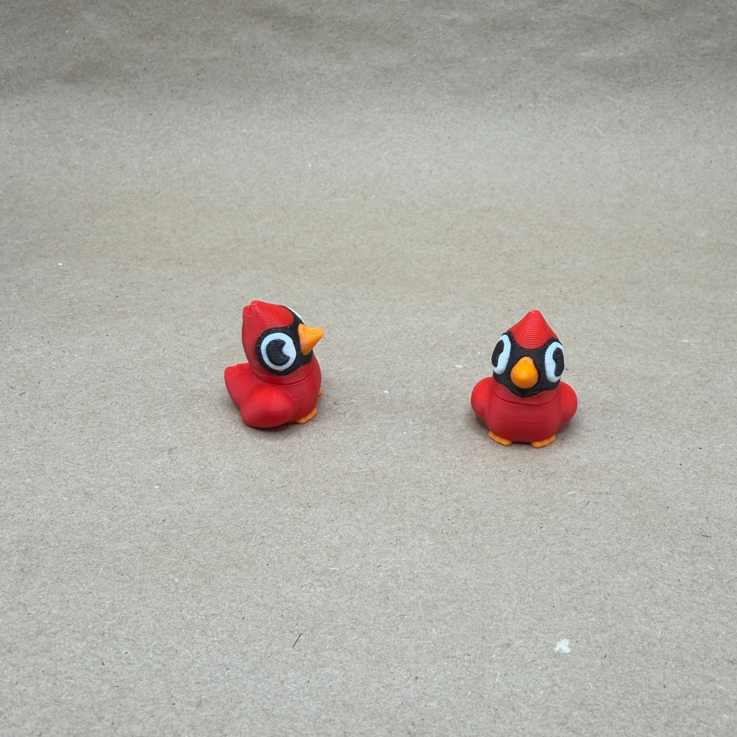 Small cardinal figurine size comparison showing 1 inch scale desk decor