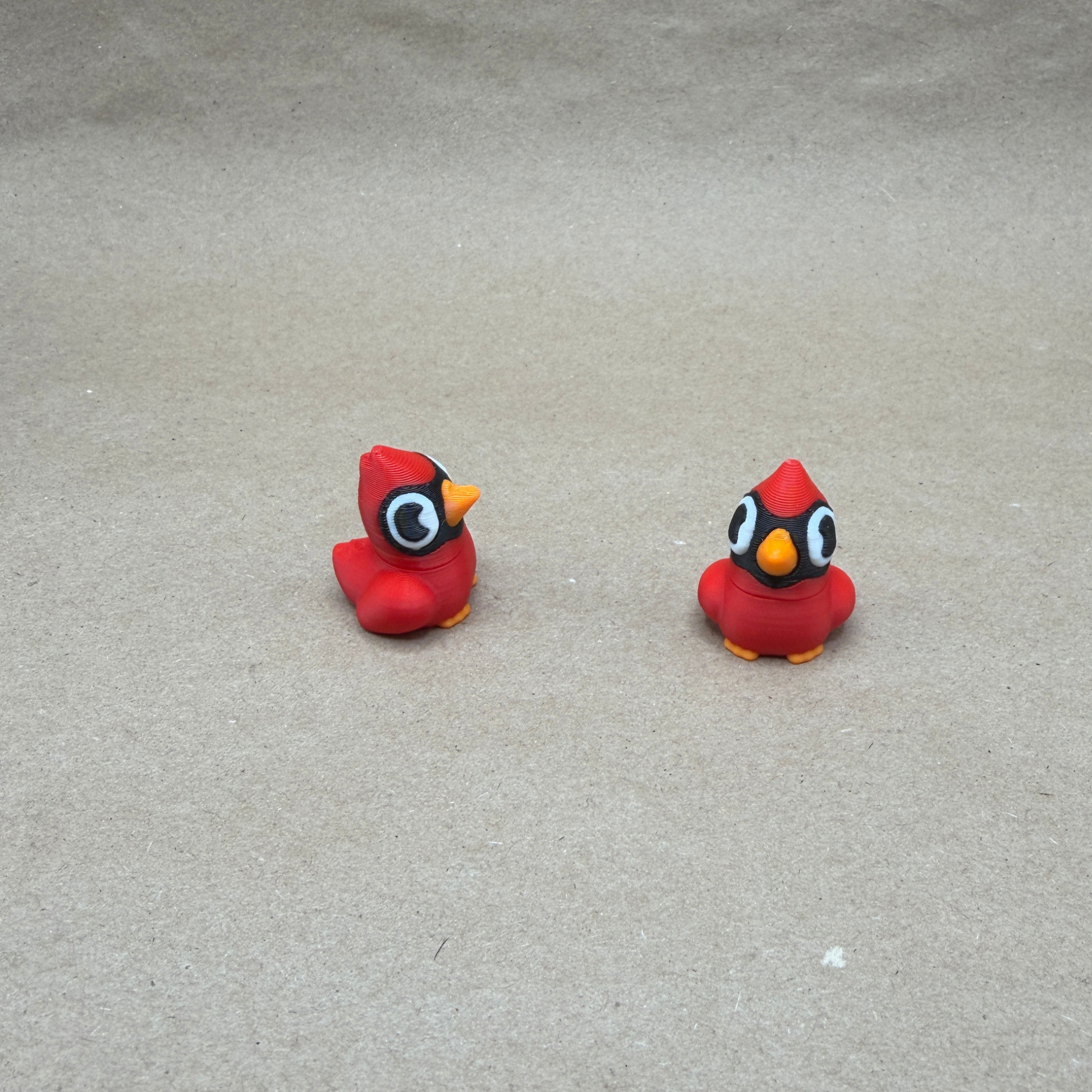 Small cardinal figurine size comparison showing 1 inch scale desk decor