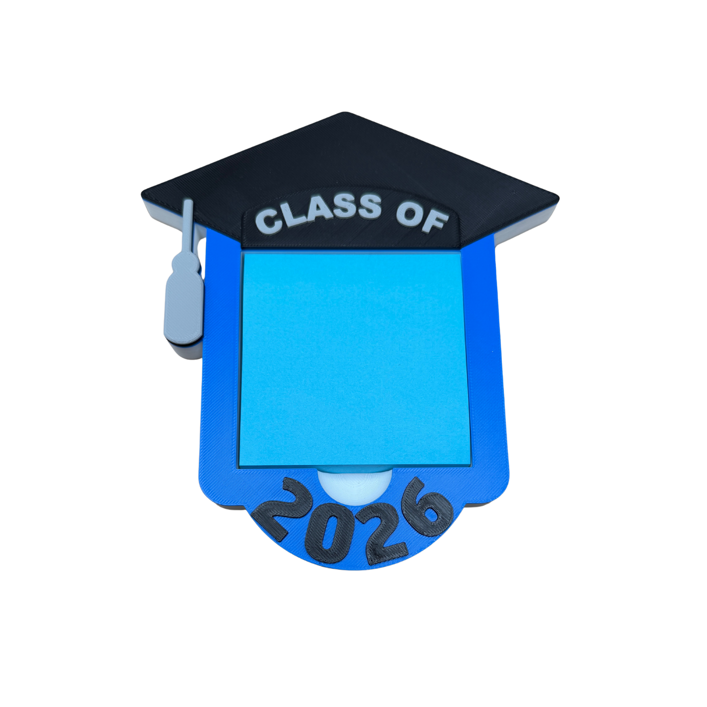 Unique grad gift for Class of 2026 — graduation cap note holder on college dorm desk