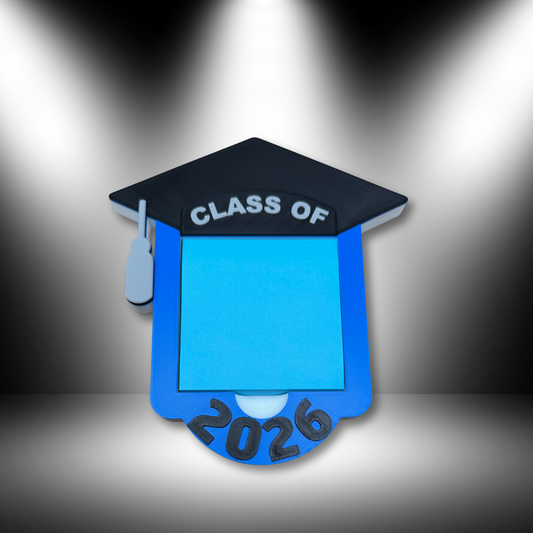 Class of 2026 sticky note holder with 3x3 sticky notes loaded, shown on desk