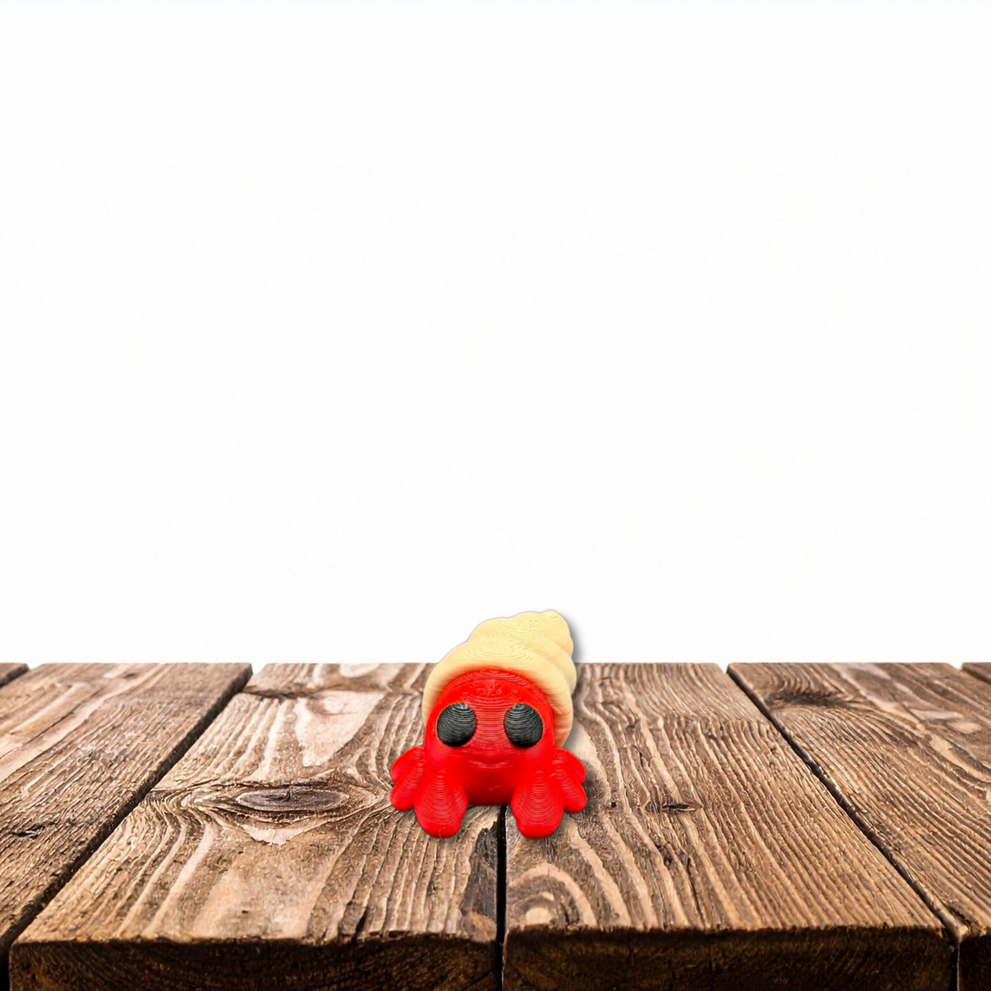 Tiny 3D printed hermit crab desk pet with moveable joints and multi-color PLA design