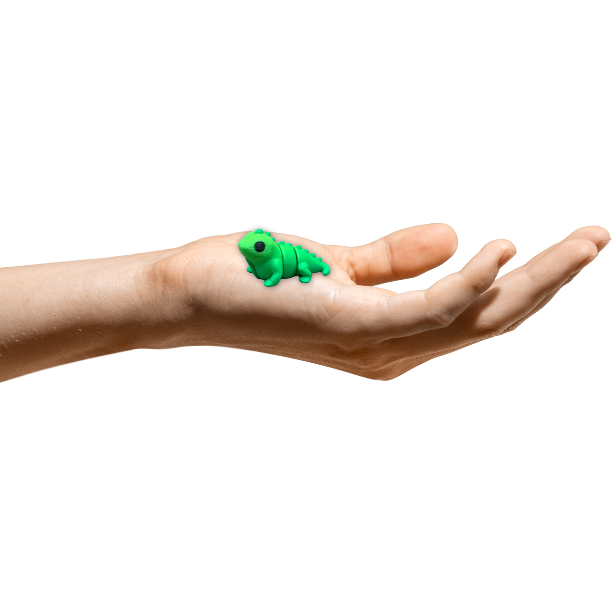 Pocket-sized 3D printed iguana desk pet posed in resting position on a surface