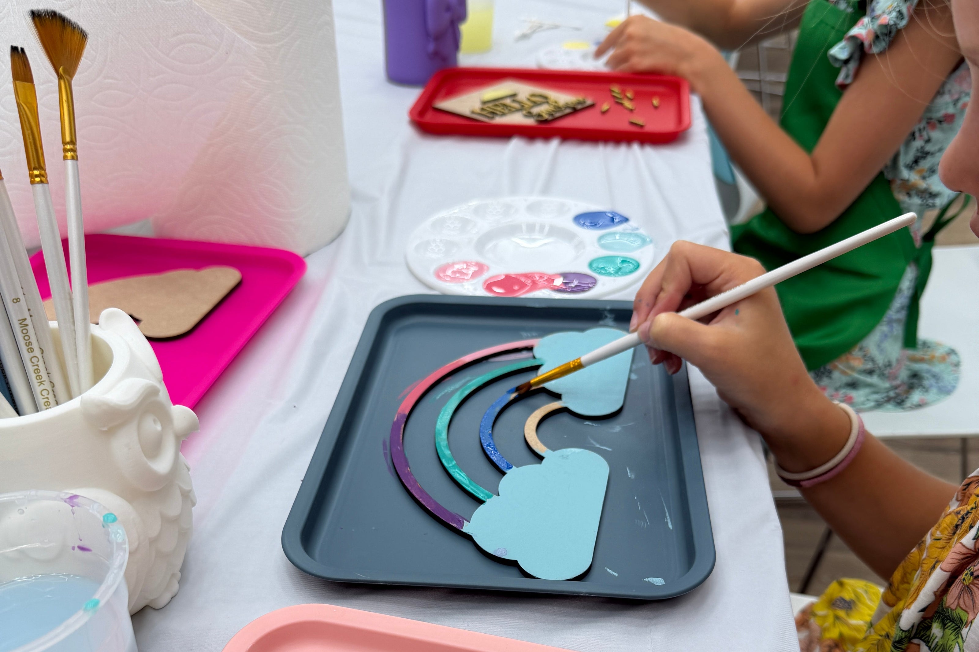 Painting a rainbow at Moose Creek Creative