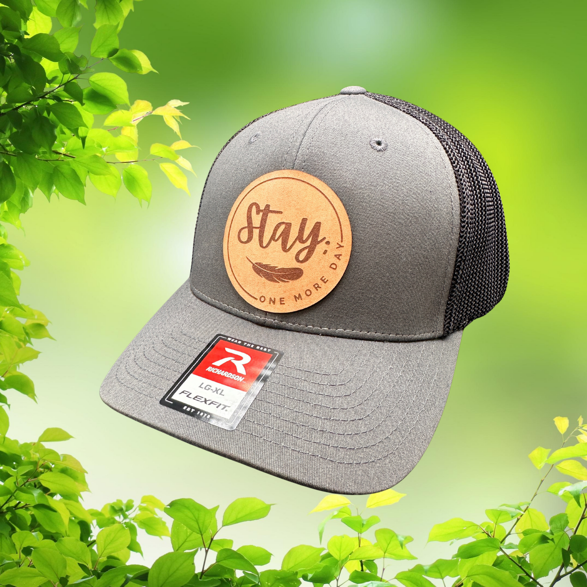 Close-up of Stay One More Day laser engraved genuine leather patch on mental health awareness hat