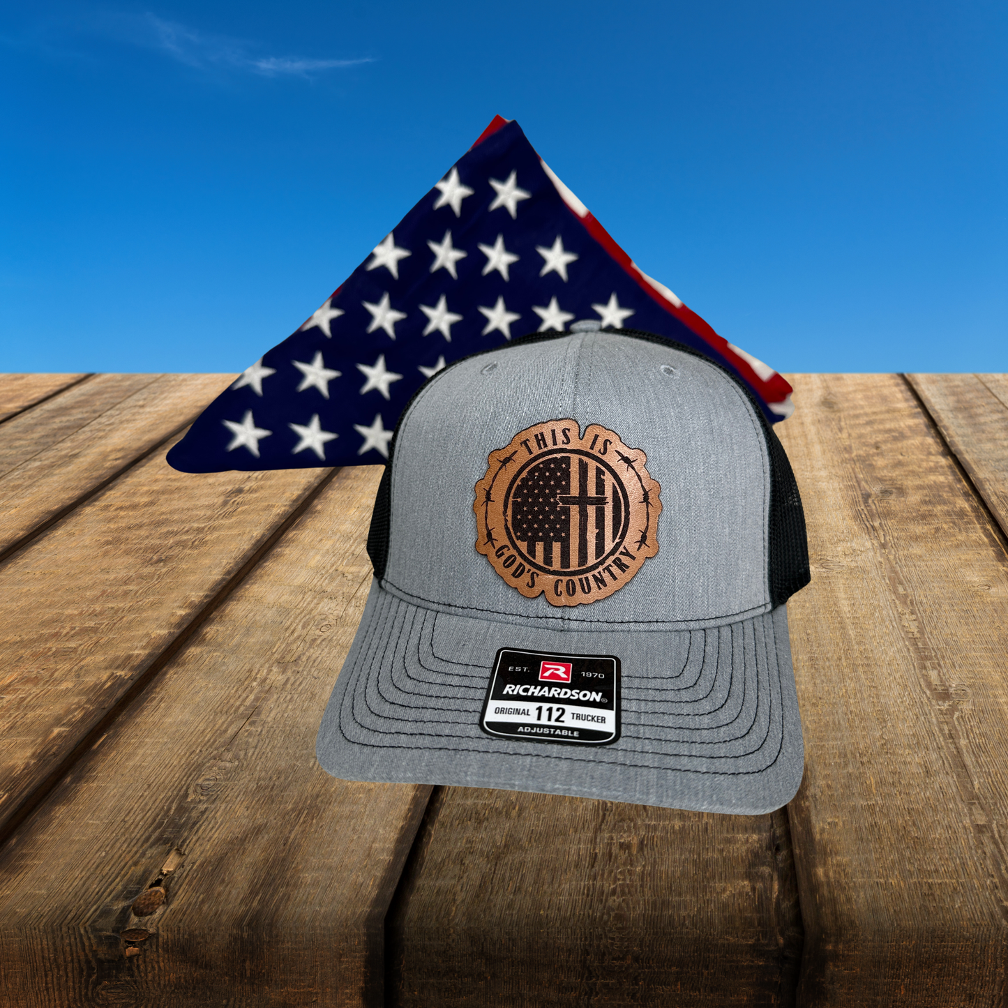 Close-up of laser engraved genuine leather patch with American flag cross and barbed wire design