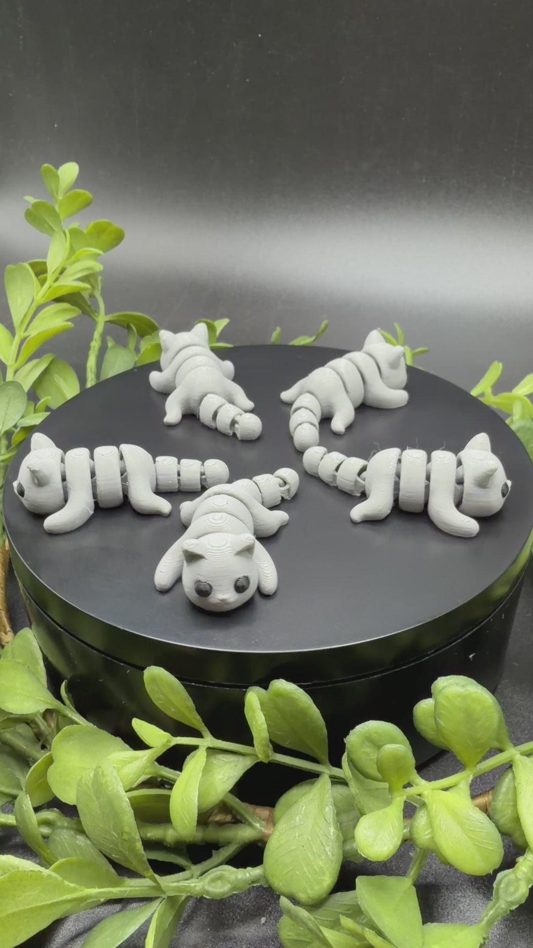 mini cat fidget toy in hand showing size and movement
