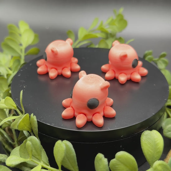 cute mini octopus fidget toy in hand showing size