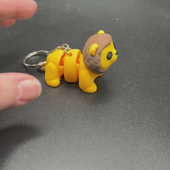 Portable lion fidget keychain backpack charm toy
