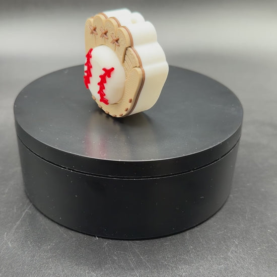 3D printed Baseball Fidget Clicker angled view showing detailed glove stitching