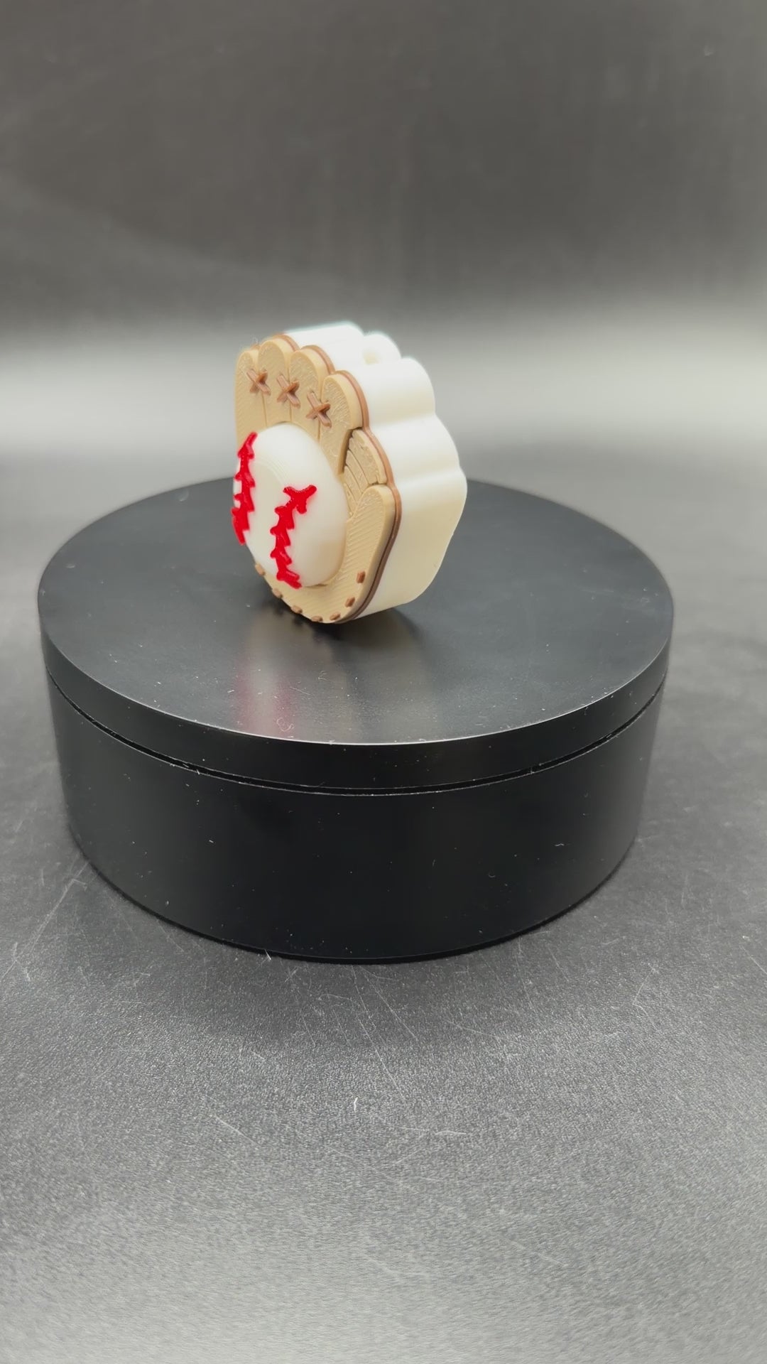 3D printed Baseball Fidget Clicker angled view showing detailed glove stitching