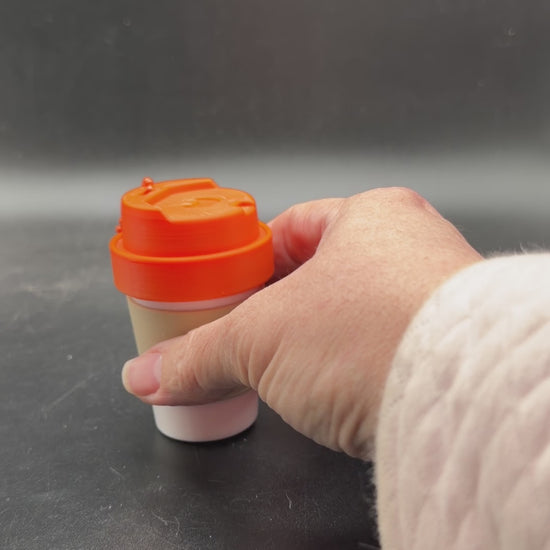 coffee cup keychain container unscrewed showing storage space