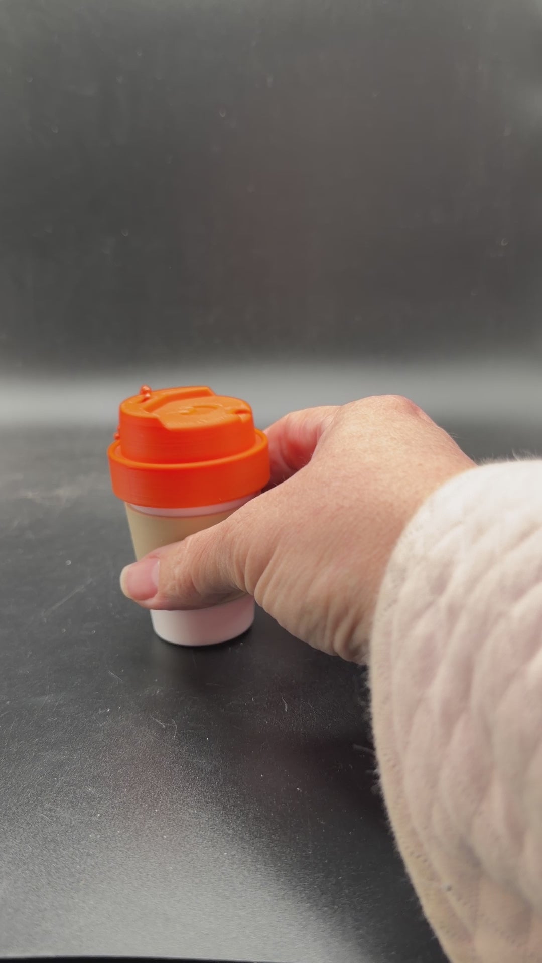 coffee cup keychain container unscrewed showing storage space